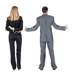 Wall Mural - Back view of business couple in suit showing thumbs up.