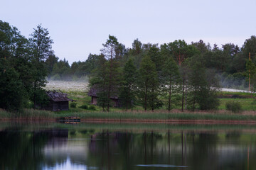 lake shore with  fog at sunset