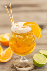 Wall Mural - Radler with ice, paper straws and orange wedges