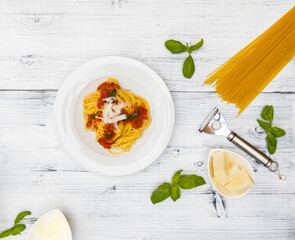 Wall Mural - still life with spaghetti with tomato sauce and basil