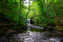 Beautiful Waterfall Along A Hiking Path In Rickett's Glen State Park In Pennsylvania.