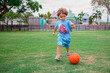 © Tamara Sales  - little boy playing with ball in Marco island Mackel park