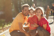 © hetmanstock2 - Family with cute little daughter. Father in a yellow t-shirt. People walks in a park.
