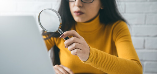 Poster - woman hand magnifier and computer