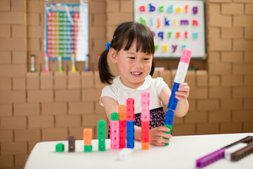 Wall Mural - toddler girl play number blocks for homeschooling