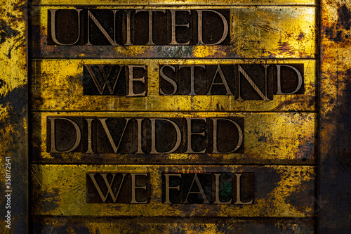 Fotomural United We Stand Divided We Fall text formed with real authentic typeset letters