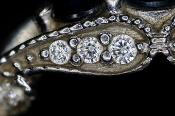 Wall Mural - Detail of clear diamonds on a white gold ring.