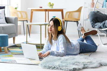 Sticker - Beautiful young woman with laptop at home