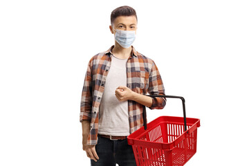 Wall Mural - Guy with a protective face mask and a shopping basket