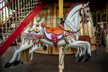 Retro Carousel White / Black Horse. Old Wooden Horse Carousel. Carousel! Horses On Vintage, Retro Carnival Cheerful Walk. CloseUp Of Colorful Carousel (roundabout) With Horses.