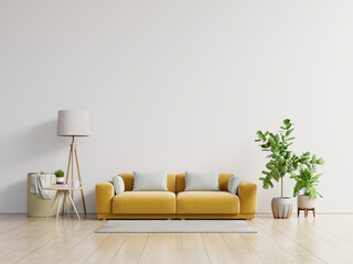 Empty living room with yellow sofa, plants and table on empty white wall background.