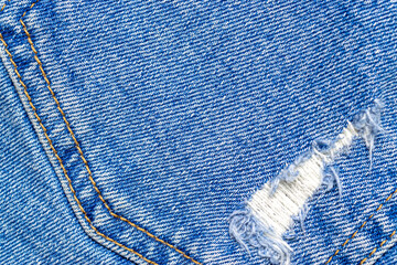 Jeans texture. Blue denim textile pattern in close up. Indigo cl