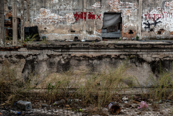 Wall Mural - Old cement wall of Deteriorated abandoned old building, Destroyed building with copy space for runaround or wraparound text. Selective focus.