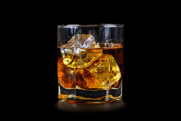 Wall Mural - Glass of whiskey with cube ice on black background