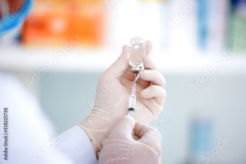 A close-up picture of a male doctor holding a syringe with vaccination, influenza medicine, male doctor, insulin, health concepts, influenza drugs