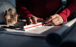 © 22January - Architect working on blueprint. Architects workplace - architectural project, blueprints, ruler, calculator, laptop and divider compass. Construction concept. Blue print is fake only for stock photo.