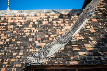 Ancient statue dragon animal in the literature architecture building on the roof of the temple at Chiang Mai province Northern Thailand