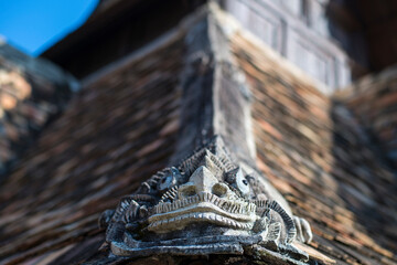 Ancient statue dragon animal in the literature architecture building on the roof of the temple at Chiang Mai province Northern Thailand