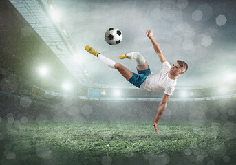 Sticker - Soccer player on a football field in dynamic action at summer day