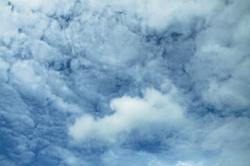 Wall Mural - picturesque clouds in the sky. window view of an airplane on a sunny gloomy day. stock photo backgro