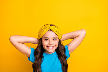 Sticker - Closeup photo of beautiful little lady model hold arms behind head peaceful resting relaxation moment good mood wear casual blue t-shirt headband isolated yellow color background