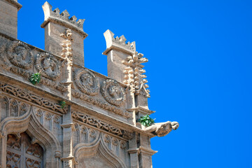 Wall Mural - stone gargoyle at the castle , details of Gothic architecture