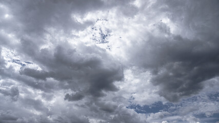 Wall Mural - picturesque clouds in the sky. window view of an airplane on a sunny gloomy day. stock photo backgro