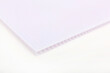 © chibelek - Polycarbonate plastic sheets panels images. PC hollow sheet for translucent roofing close up. Single white color on white background