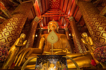 Wall Mural - Ayutthaya, Thailand -July, 31, 2018 : Giant golden Buddha in Wat Phanan Choeng, Buddha statue is called Luang Pho Tho of Ayutthaya, Thailand