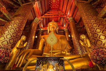 Wall Mural - Ayutthaya, Thailand -July, 31, 2018 : Giant golden Buddha in Wat Phanan Choeng, Buddha statue is called Luang Pho Tho of Ayutthaya, Thailand