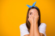 Close up photo of scared frustrated girl hide palms face look copyspace feel fear about her mistake wear trend pop shine clothes isolated over bright shine color background