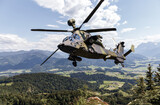 German attack helicopter flies over german landscape