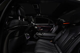 Fototapeta Do pokoju - Comfortable interior of prestige modern car. Back leather seats with  ambient light.