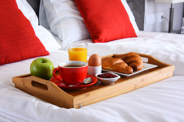 Wall Mural - Breakfast on tray in bed in hotel room