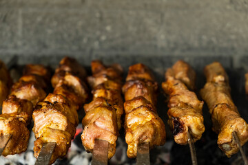 Wall Mural - Shish kebab on a skewers. Pork meat on skewers. Copy space