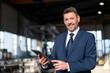 © Westend61 - Portrait of a confident businessman with tablet in a factory