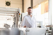 © Westend61 - Portrait of a confident mature businessman in a factory