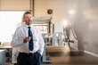 © Westend61 - Portrait of a confident mature businessman in a factory