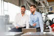 © Westend61 - Two businessmen with laptop having a meeting in a factory