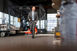 © Westend61 - Young businessman with tablet walking in a factory