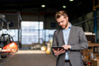 © Westend61 - Young businessman using tablet in a factory
