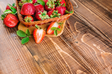 Wall Mural - Many ripe tasty strawberries on the wooden background. Copy space