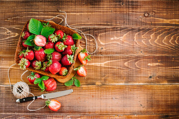 Wall Mural - Many ripe tasty strawberries on the wooden background. Copy space