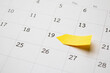 © Kwangmoozaa - Blank yellow sticky adhesive post note paper planner with space on calendar page background for business planning appointment meeting concept