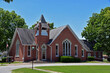red brick church in a small town