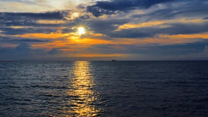 Wall Mural - Sunset time above the ocean, water surface at sunset time, nature background static shot