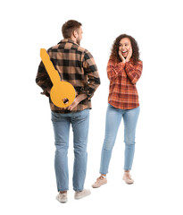 Sticker - Happy young couple with big paper key on white background