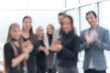 © ASDF - close up. group of happy employees applauding together