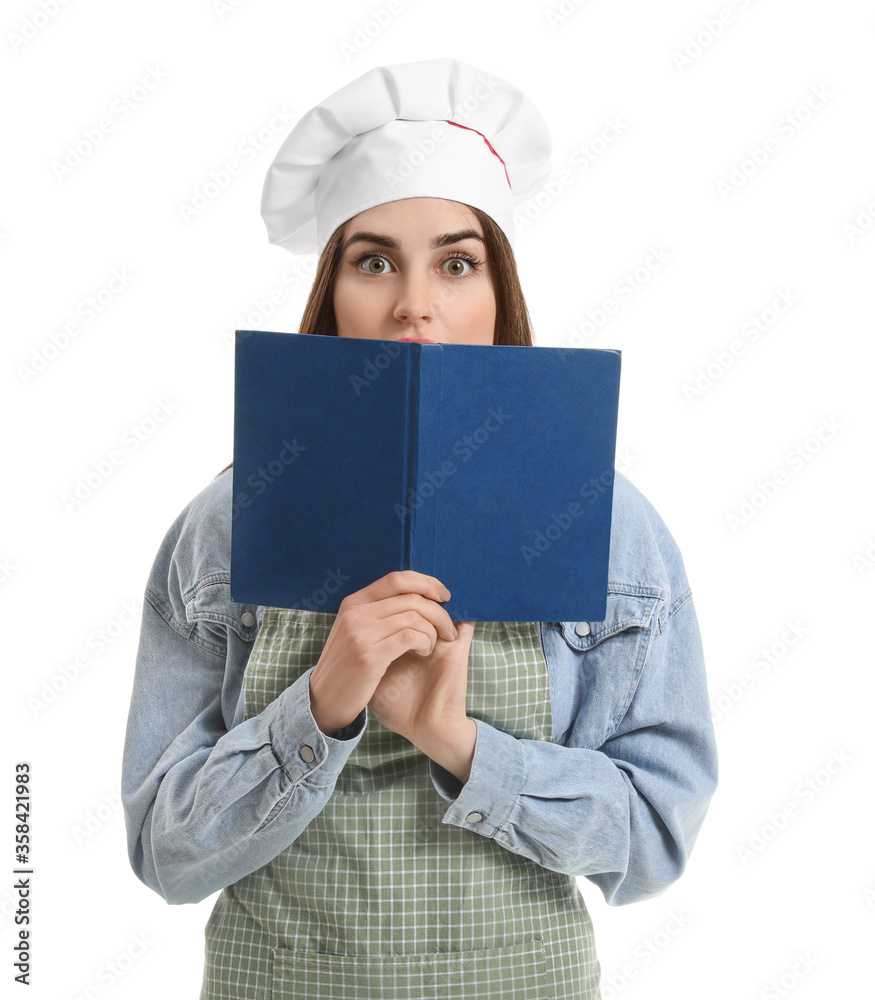 Young woman with recipe book on white background