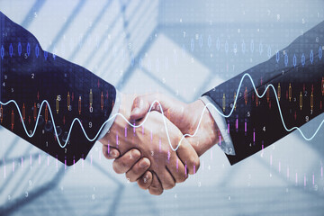 Double exposure of forex graph hologram and handshake of two men. Stock market concept.